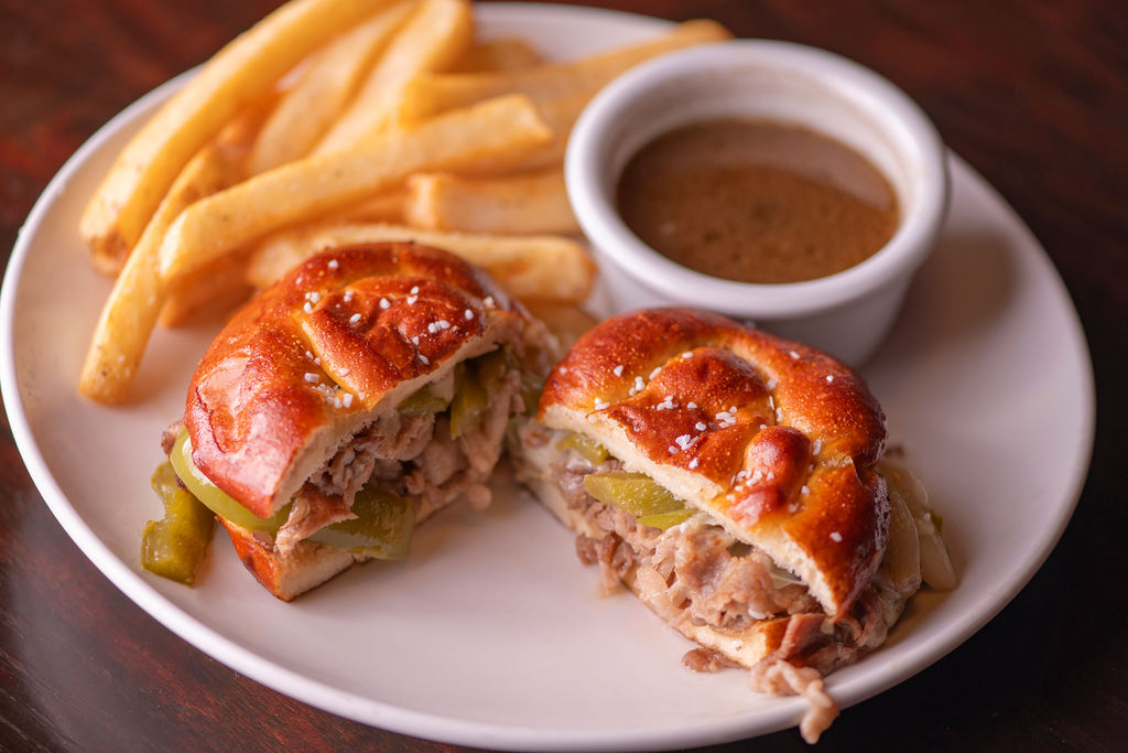 thinly sliced prime rib, sautéed green peppers & onions, mozzarella & provolone with rich au jus, pretzel bun
