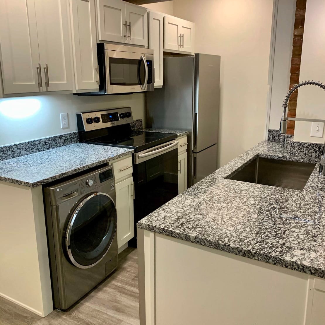 Kitchen with Stainless Steel Appliances and Granite Countertops 