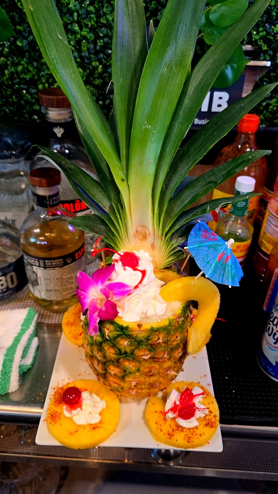 Tropical pineapple drink served at Catramex Restaurant featuring a refreshing handcrafted cocktail presented inside a fresh pineapple with authentic Latin-inspired flavors in Southern Maine.