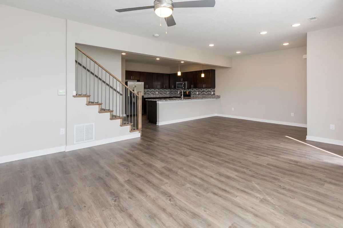 Spacious living room with staircase