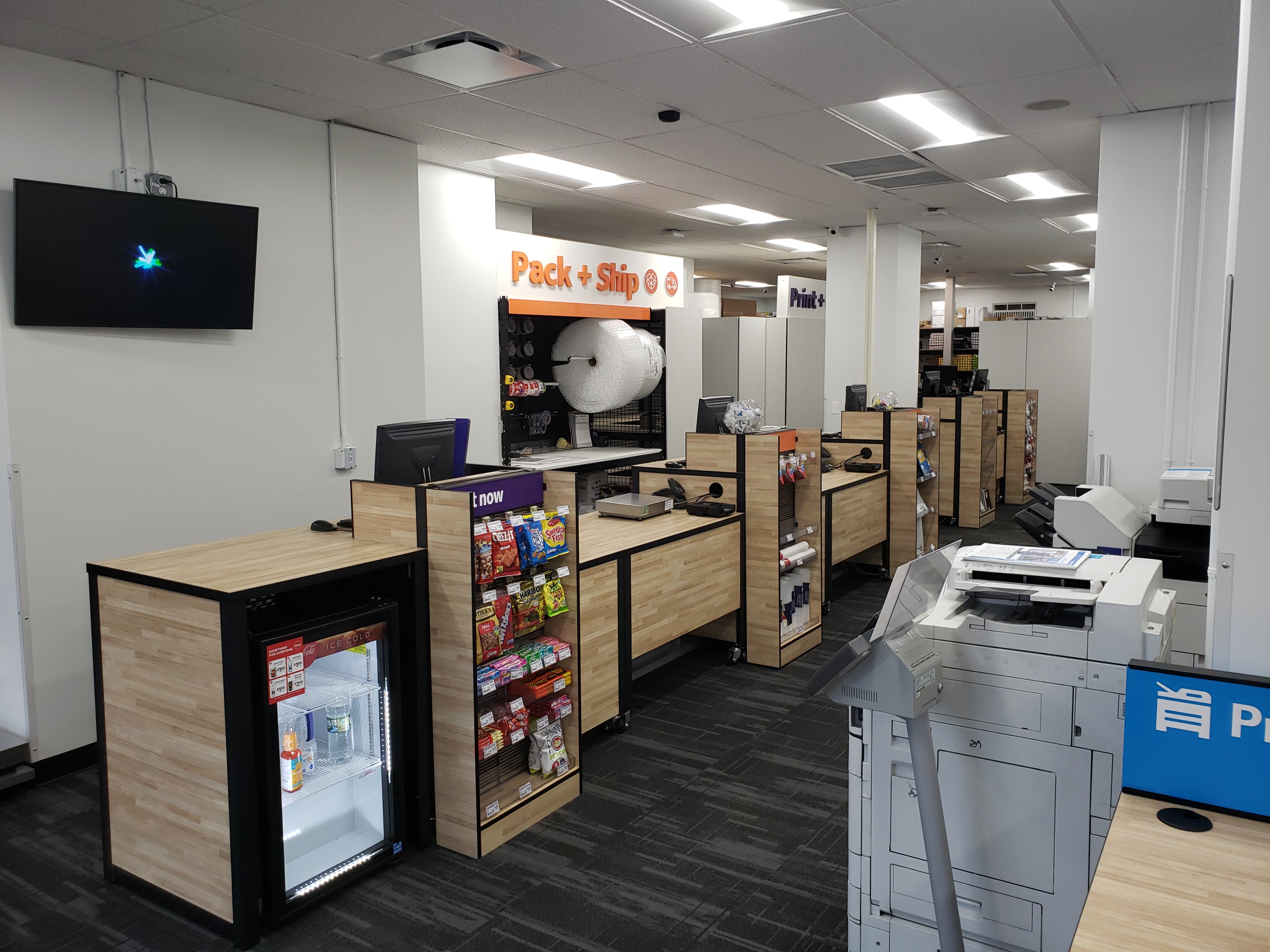 Front Counter and Service Area &ndash; Customer service counters at FedEx Office Manhattan East Village for printing, copying, shipping, and business services.