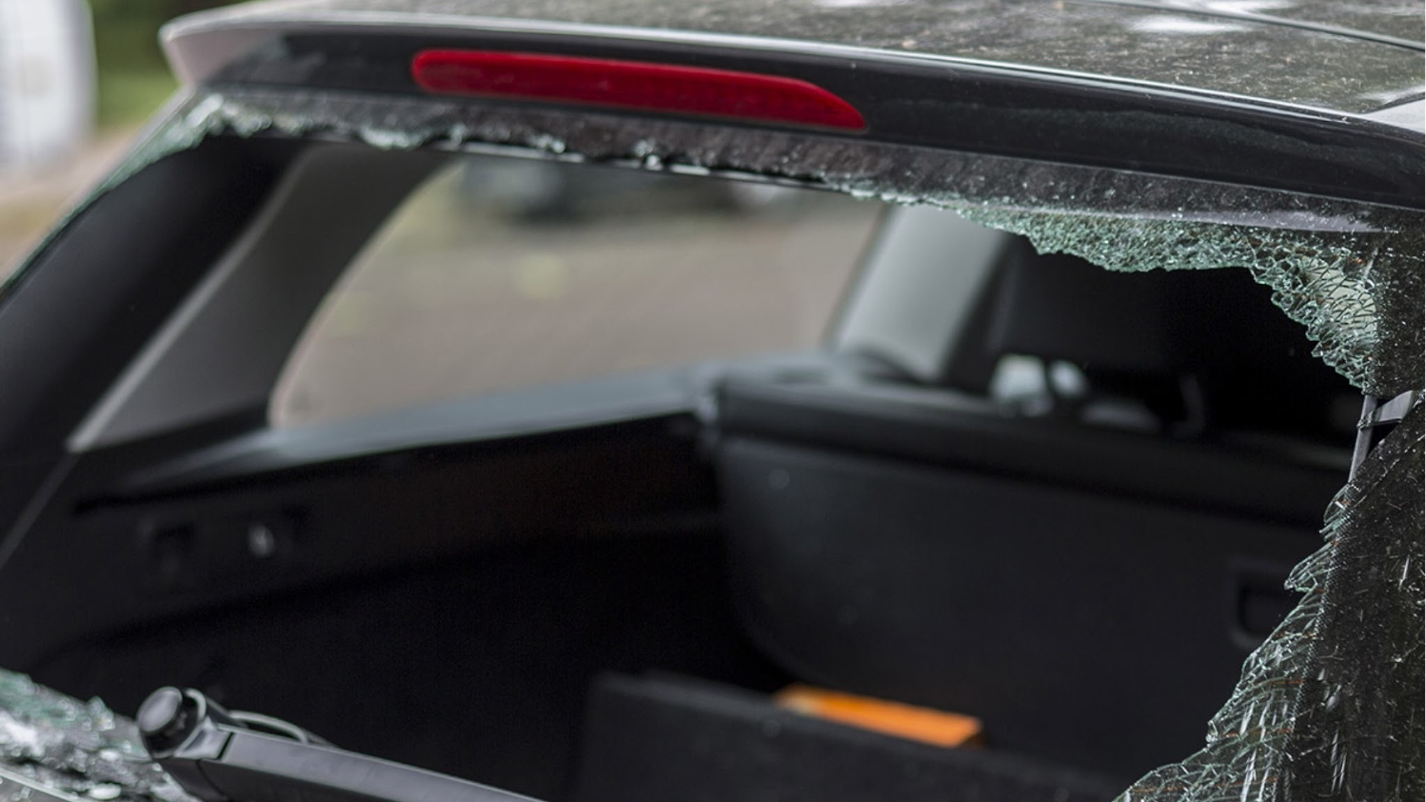 Shattered rear glass on an SUV. We replace back glass with the defroster lines and factory tint matched to your vehicle.