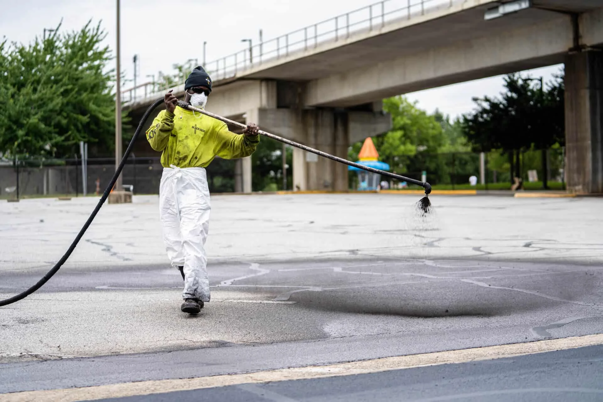 Blackjack Paving crew Sealcoating a parking lot