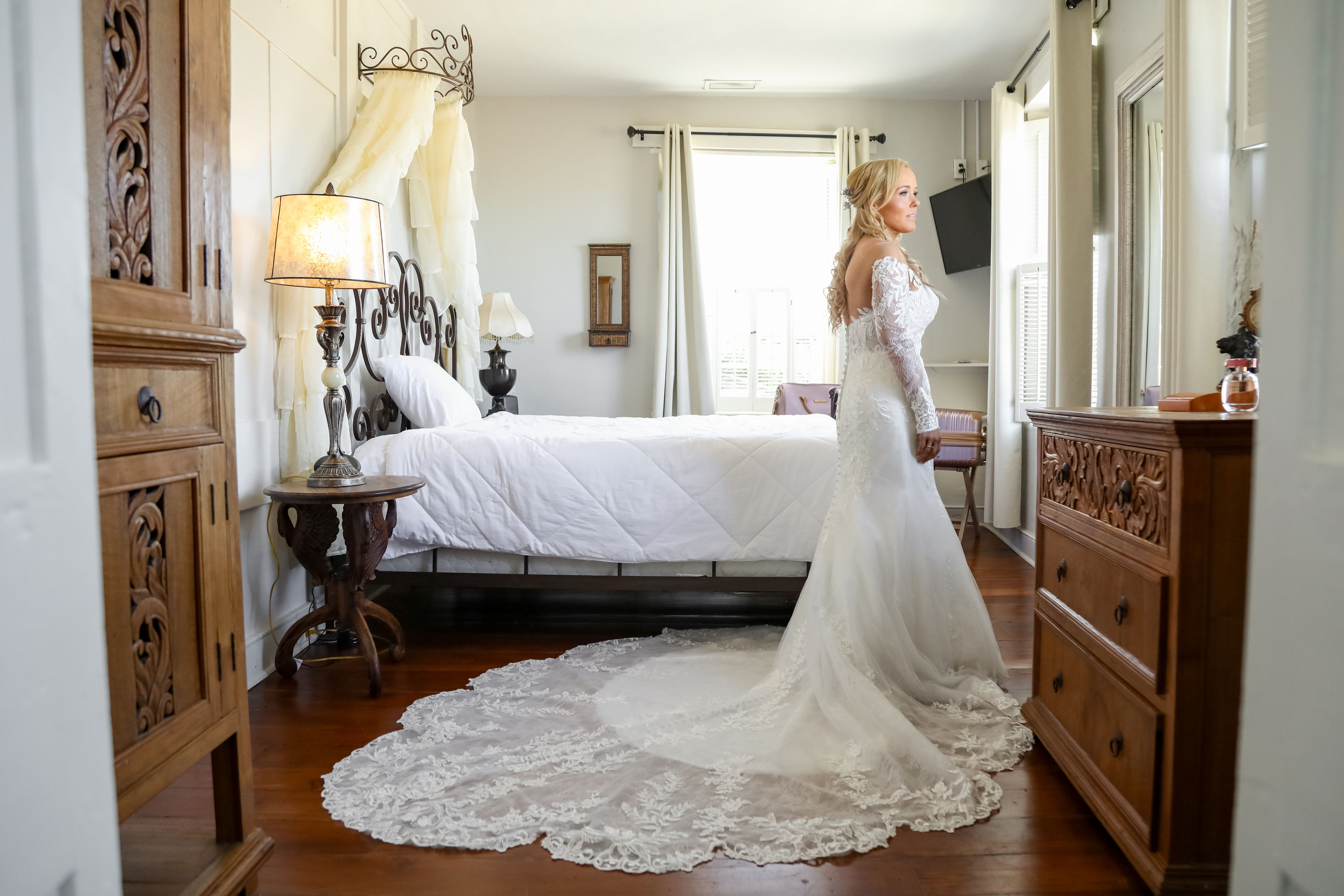 bride looking out window at sanchez house wedding venue 