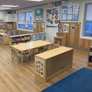 Bright and colorful preschool classroom at Childcare Network with age-appropriate learning materials 