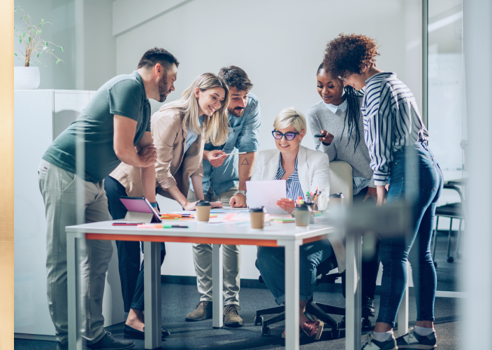 People gathered around a boardroom table.