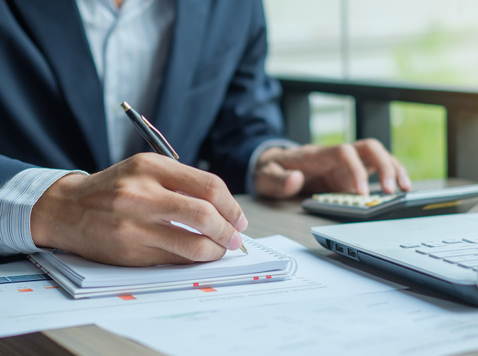 Close-up of a business owner reviewing documents.