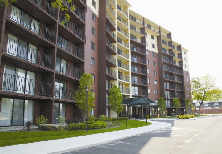 This image highlights the beautifully maintained exterior of Solaire Senior Living in Southfield, MI, a luxury senior apartment community designed for adults 62 and better seeking a peaceful and comfortable lifestyle. The modern multi-story building features private balconies, large windows, and attractive landscaping that create a welcoming and serene environment. Solaire offers spacious studio, one-, two-, and three-bedroom senior apartments with convenient access to nearby healthcare, parks, shopping, and entertainment throughout the Southfield and Metro Detroit area.