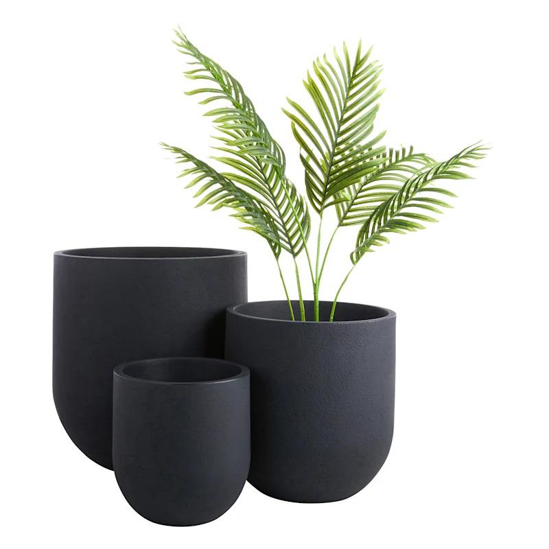 A medium-sized rustic cask planter in black, ideal for showcasing colorful flowers or greenery in outdoor gardens or indoor spaces.