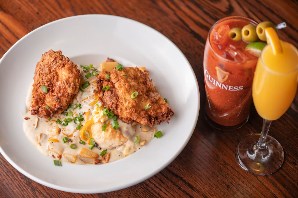 scrambled eggs, biscuit, cheddar, chopped bacon & country gravy, roasted potatoes, topped with buttermilk fried chicken