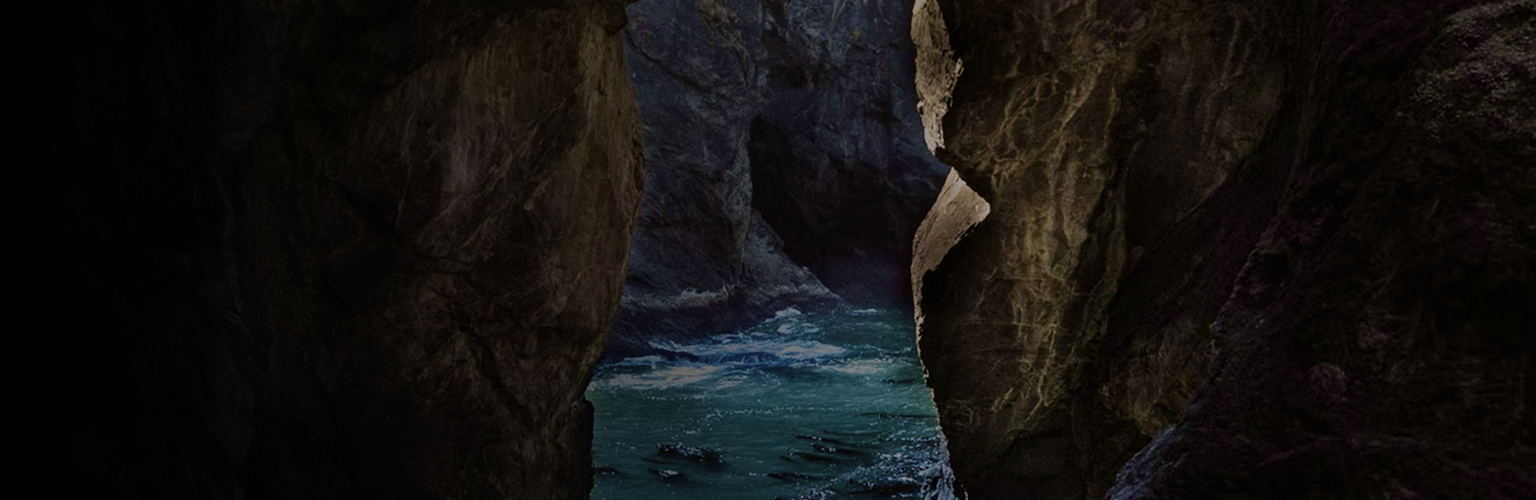 View of rushing water as seen through rockfaces.