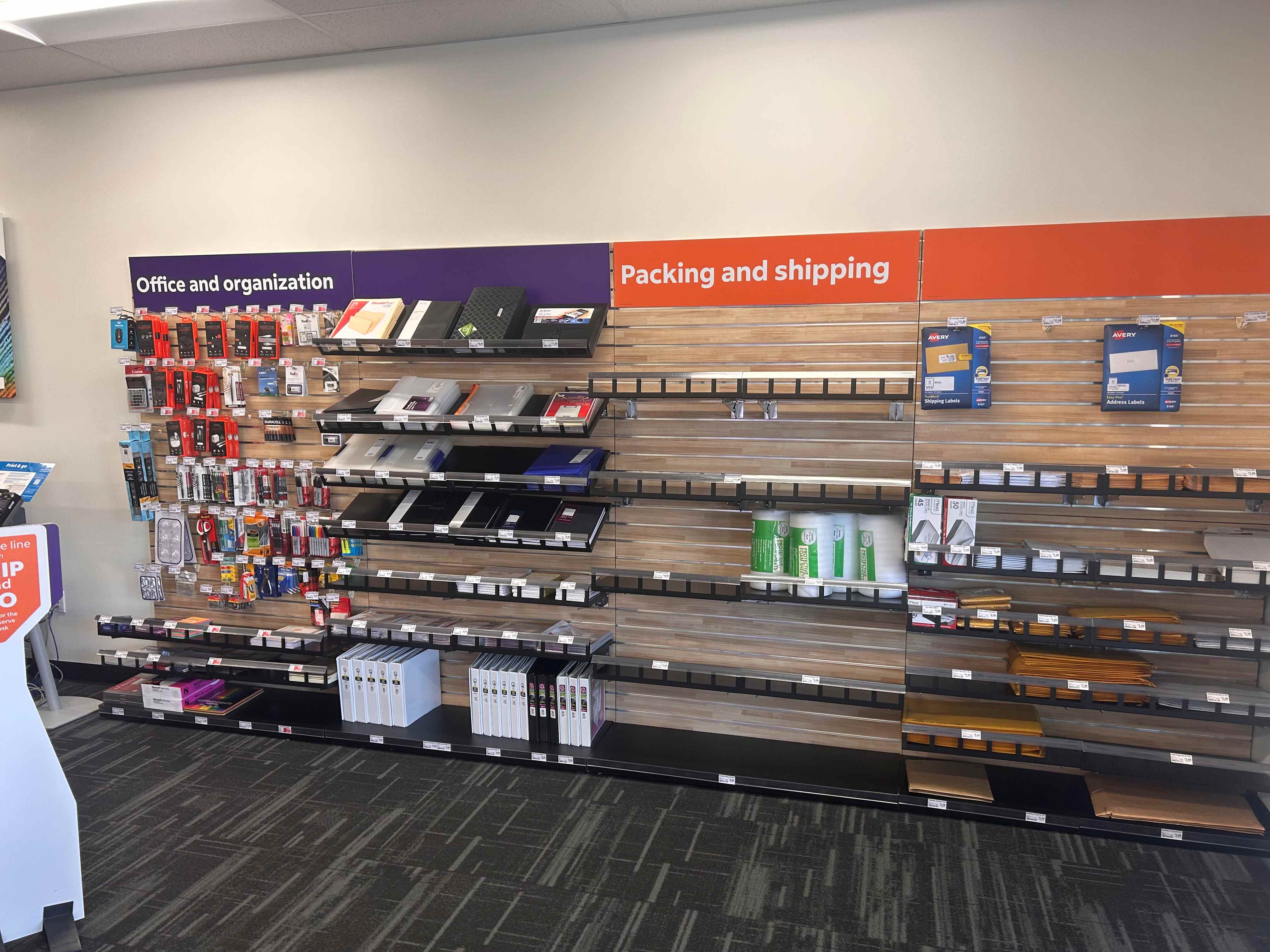 The retail wall at the Mesa FedEx Office, featuring office organization, packing, and shipping suppl 