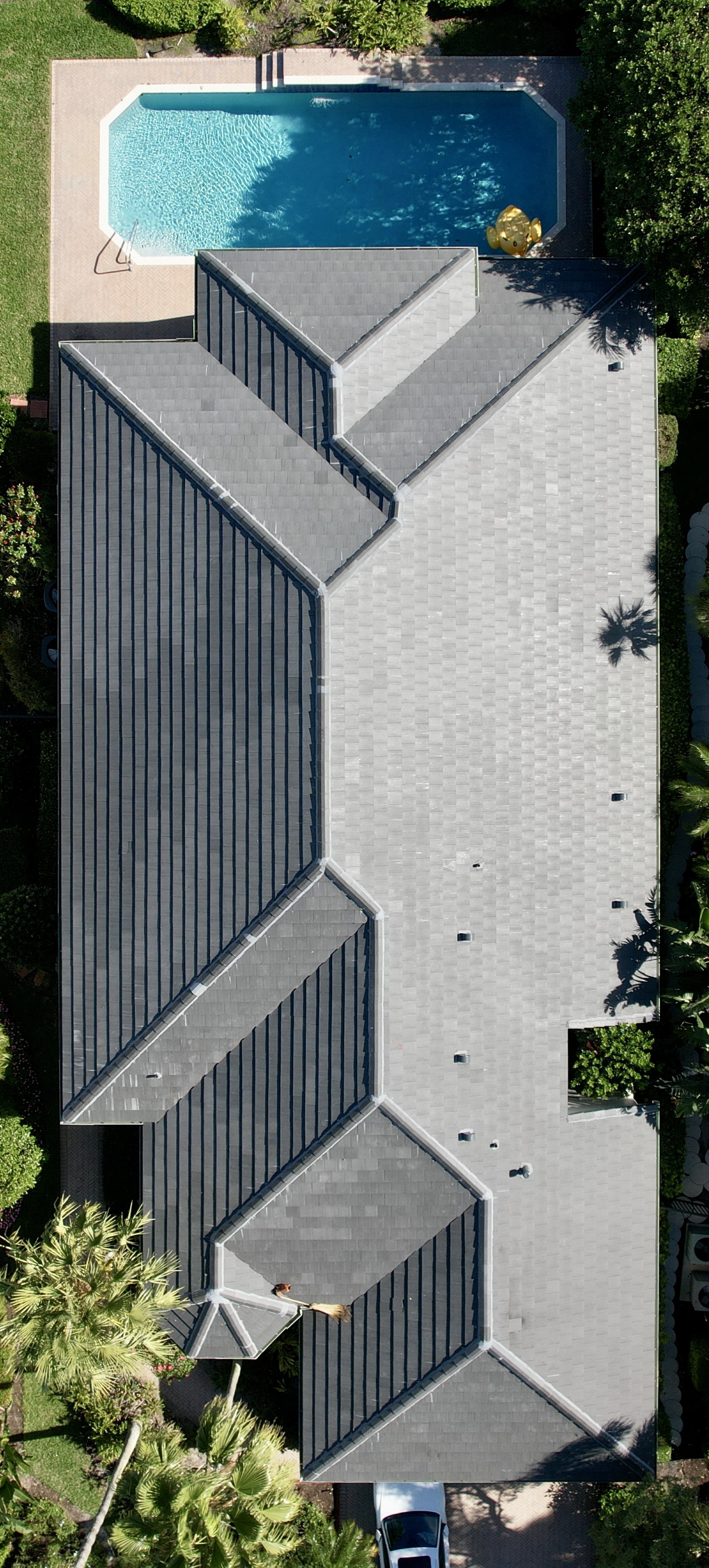 We replaced this roof and installed a flat tile from Newpoint. This tile color is called Dark Charcoal.
