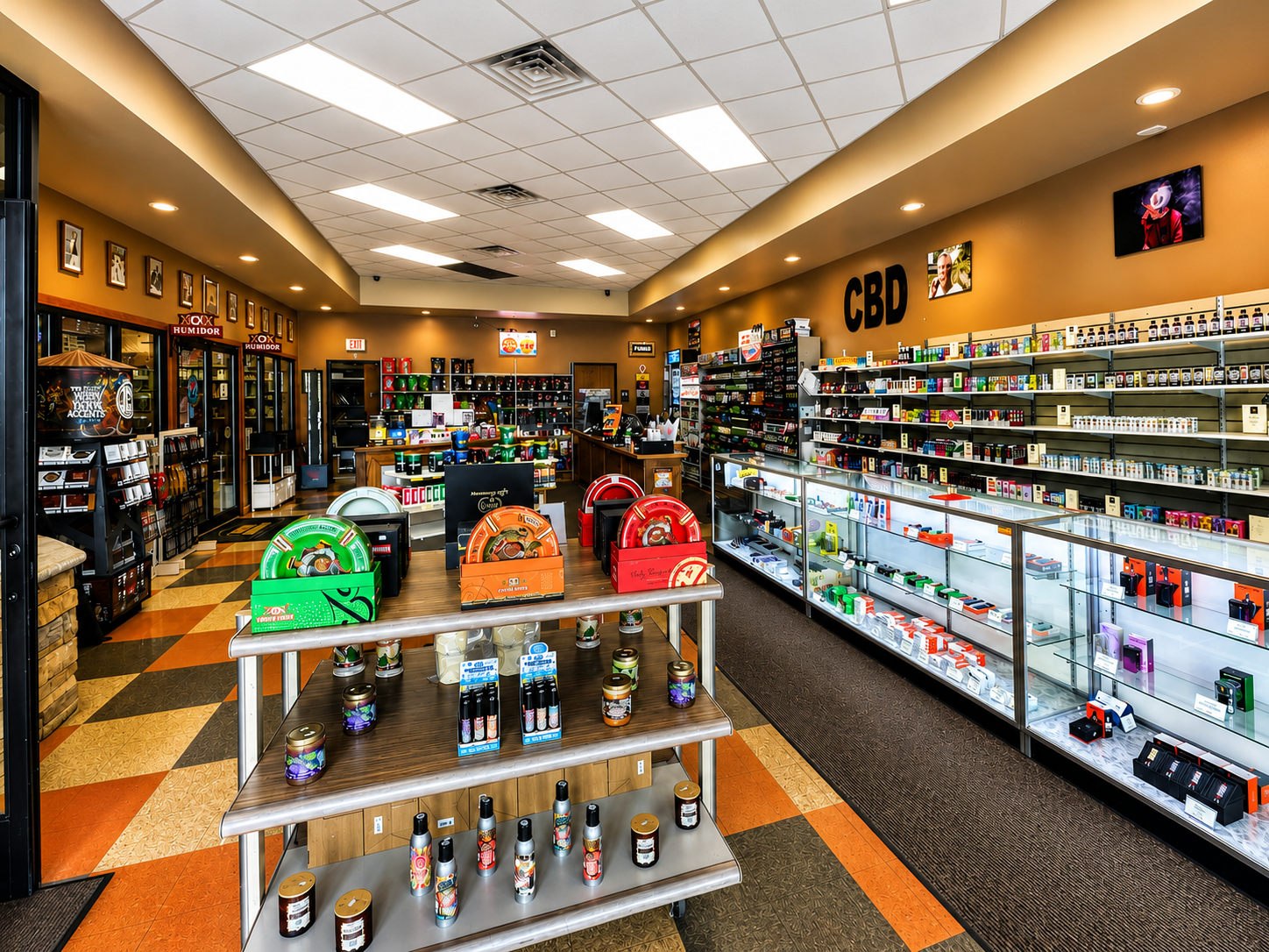 Explore a modern retail store featuring a wide selection of premium cigars, vape devices, CBD products, and smoking accessories. The bright, organized layout makes it easy for customers to browse top-quality products in a comfortable and professional shopping environment.