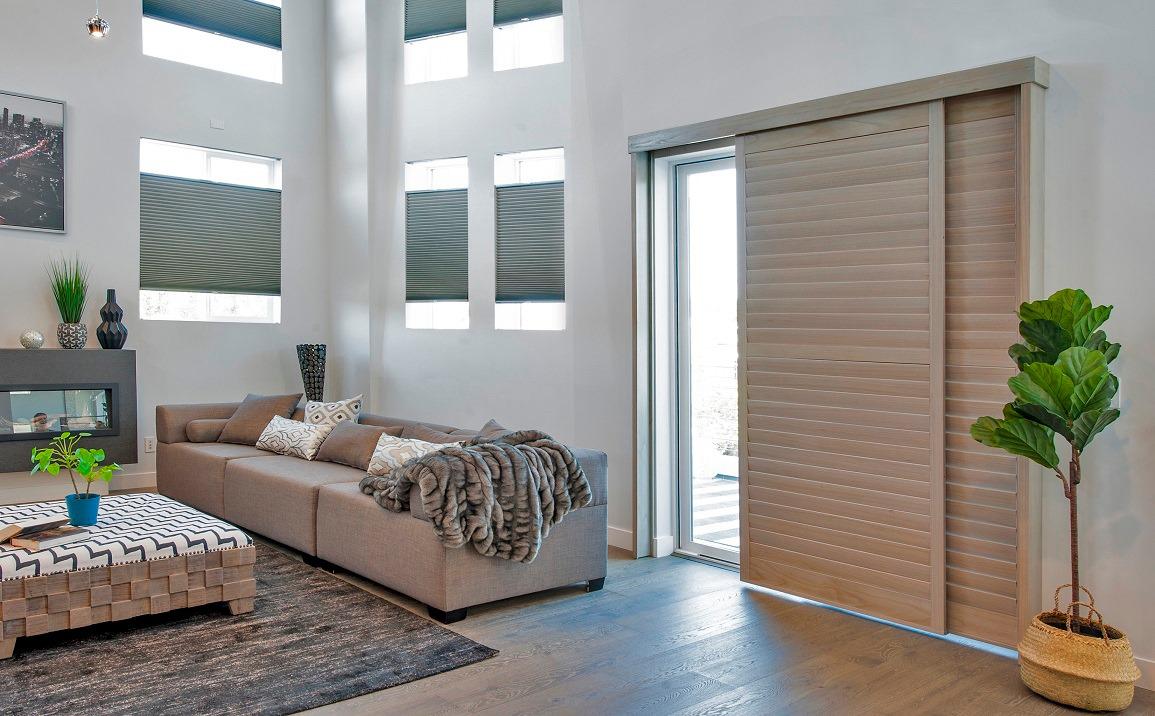 Blinds don't have to be boring! As you can see from these wonderful Sliding Bypass Shutters and Cellular Shades in this home. They add color and texture to a room whilst allowing the home owner to control the sun glare and privacy. #BudgetBlindsOfGlendale #WindowWednesday #FreeConsultation #Cellular