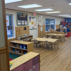 Bright and colorful preschool classroom at Childcare Network with age-appropriate learning materials 