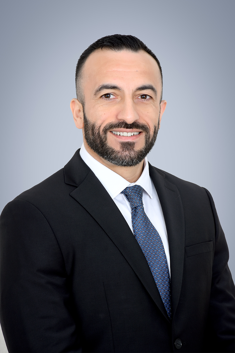 Headshot of Hassan Khan