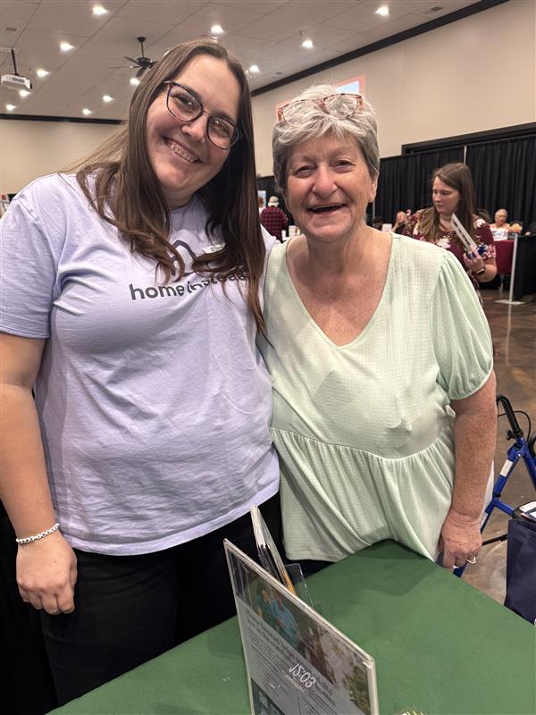 Caregiver supporting an older adult with daily routines and companionship.