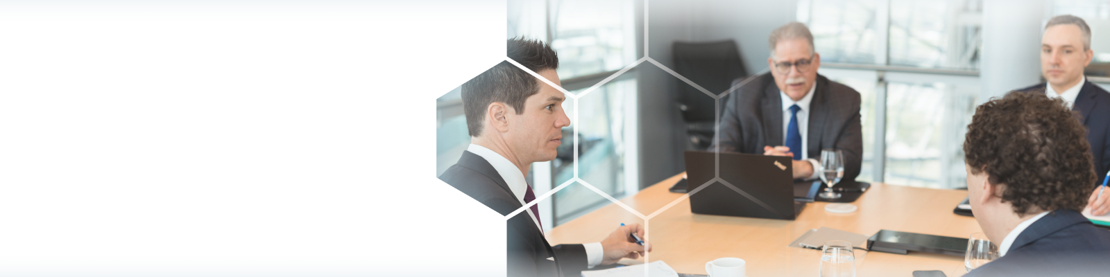 The Winestock Childerhouse team collaborating around a boardroom table.