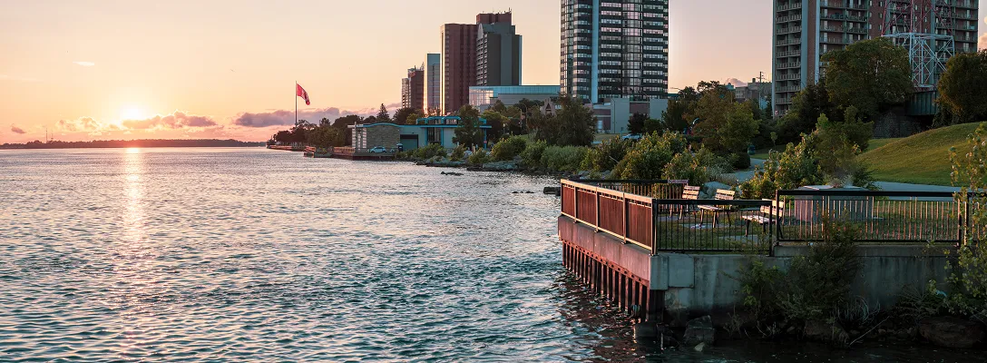 The Windsor waterfront alongside the Detroit River at sunset.