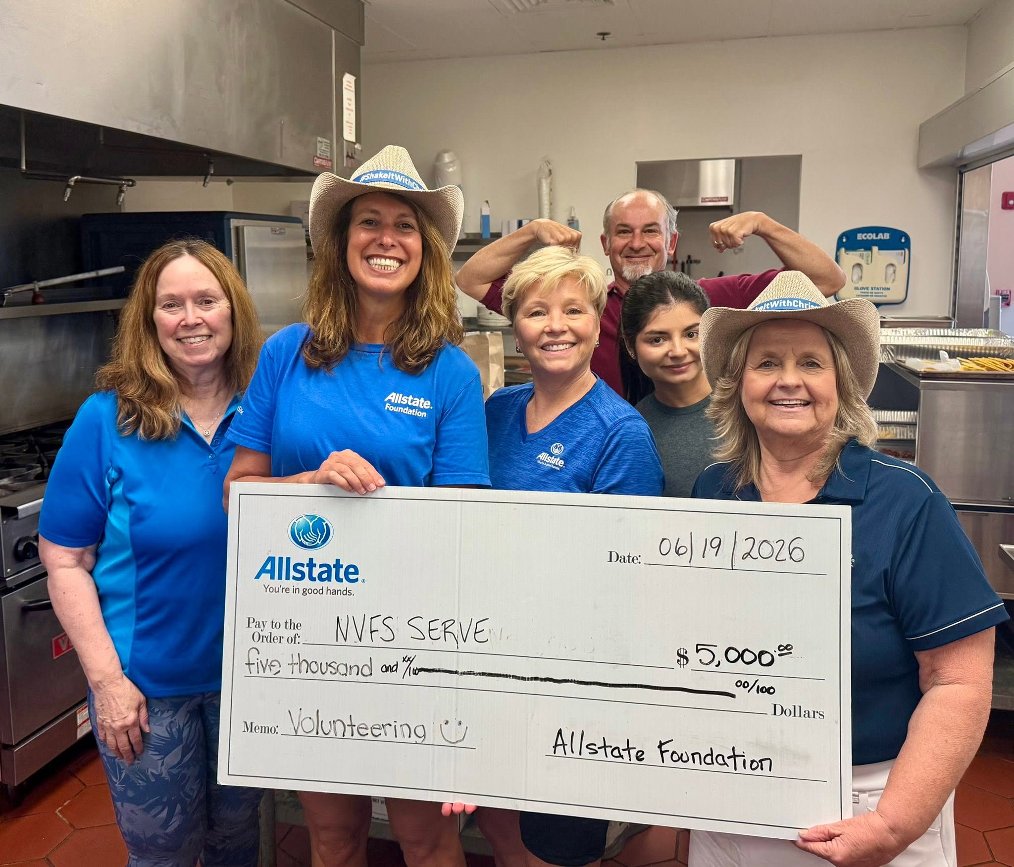 Local Gainesville, VA Allstate Insurance Agent, Christine Angles, volunteering with her team at the NVFS Serve shelter. The Allstate Foundation showed their support of their volunteer efforts and gave them a $5,000 Helping Hands Grant.
