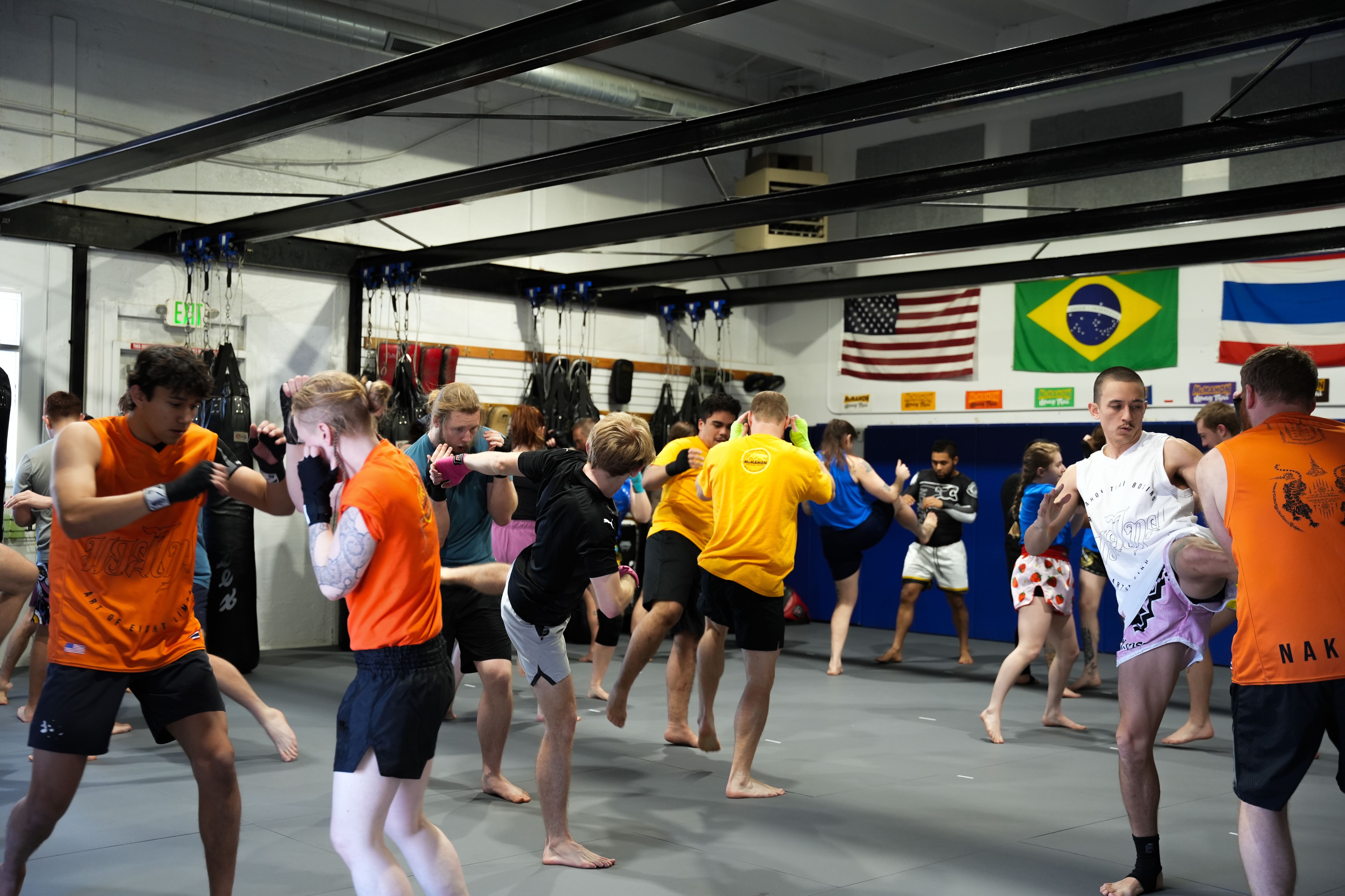 Looking for a workout that pushes your limits and builds real-world striking skills?
Our Adult Muay Thai classes combine technique, conditioning, and pad work to help students develop power, speed, endurance, and confidence. Whether you're stepping into a gym for the first time or refining your skills, you'll find expert coaching and a motivating training environment at McMahon Training Center.
Train hard. Stay disciplined. Keep improving.