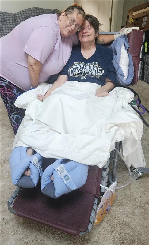 Caregiver providing companionship and support in a home setting.