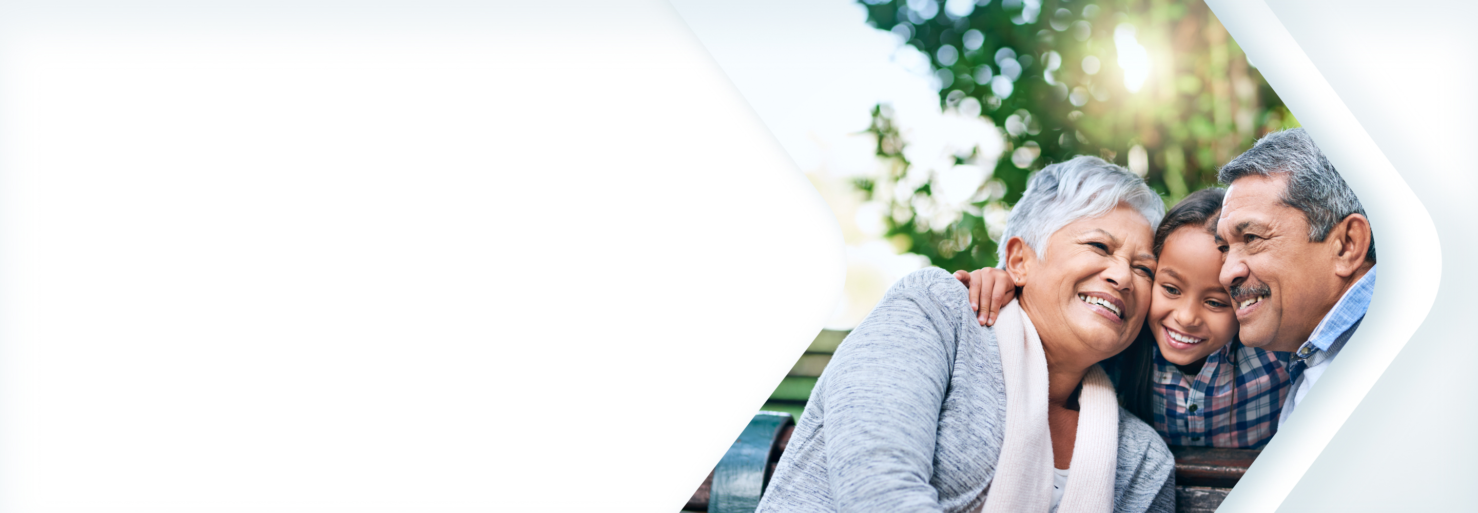 An intergenerational family sharing a hug.