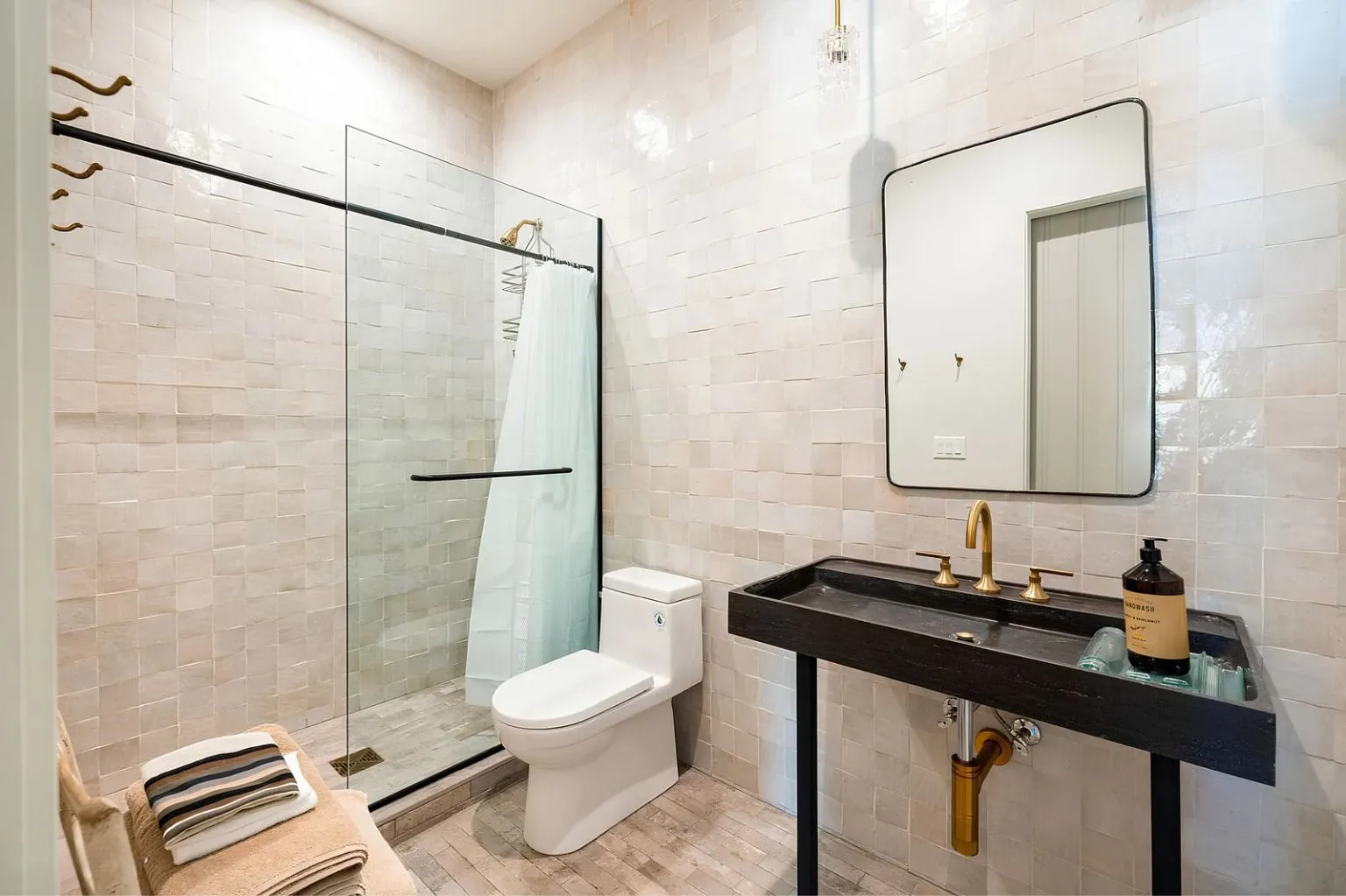 Modern bathroom renovation featuring a frameless glass shower, tile walls, and premium fixtures. Designed to improve functionality while delivering a clean, luxurious appearance.
