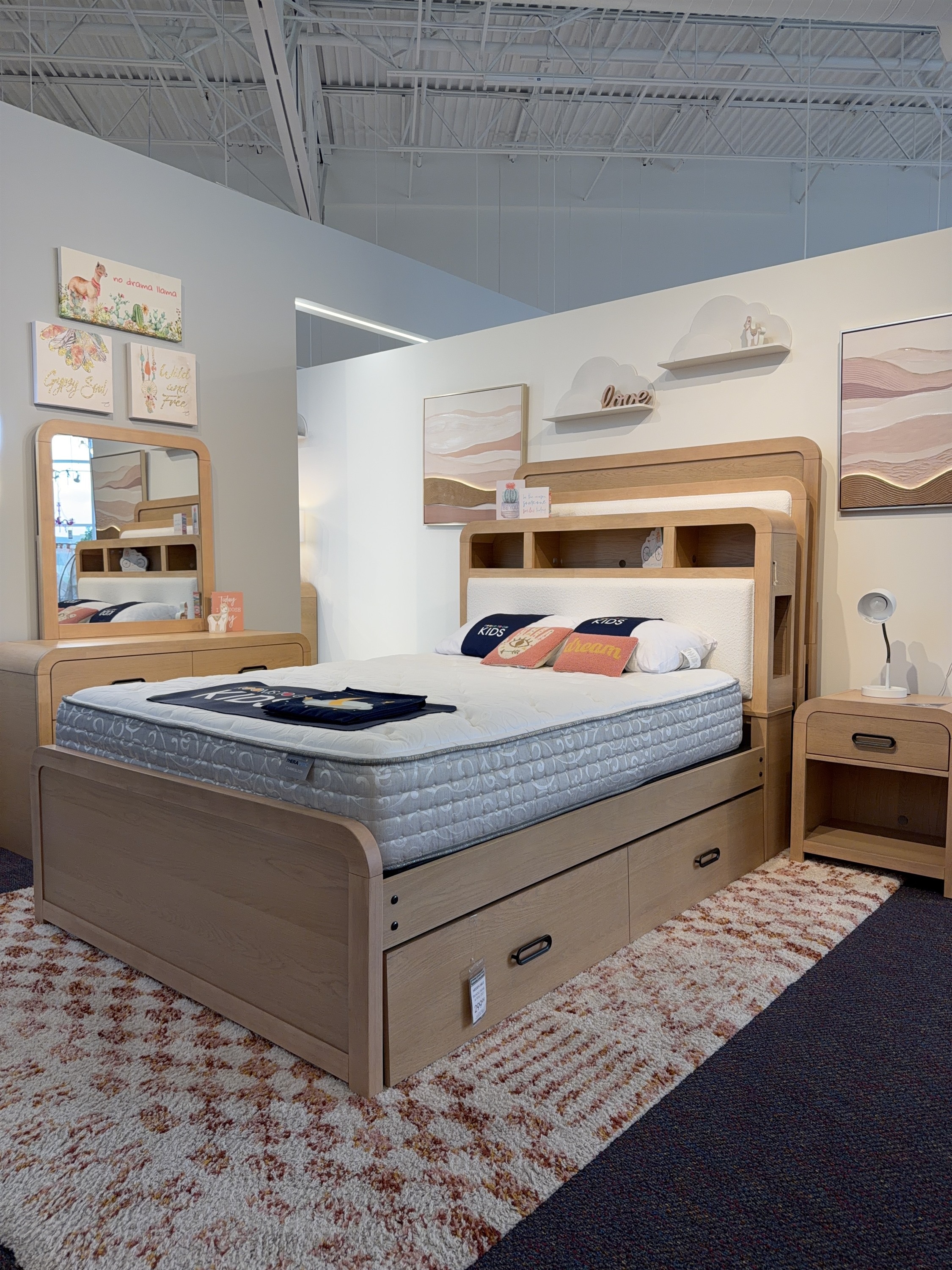 Shop the natural wood bookcase headboard bed with built-in shelving and nightstand at Rooms To Go Kids in 2026.