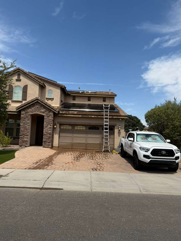 SunWorx Solar Services completing professional residential solar panel cleaning at a home in Gilbert, Arizona.