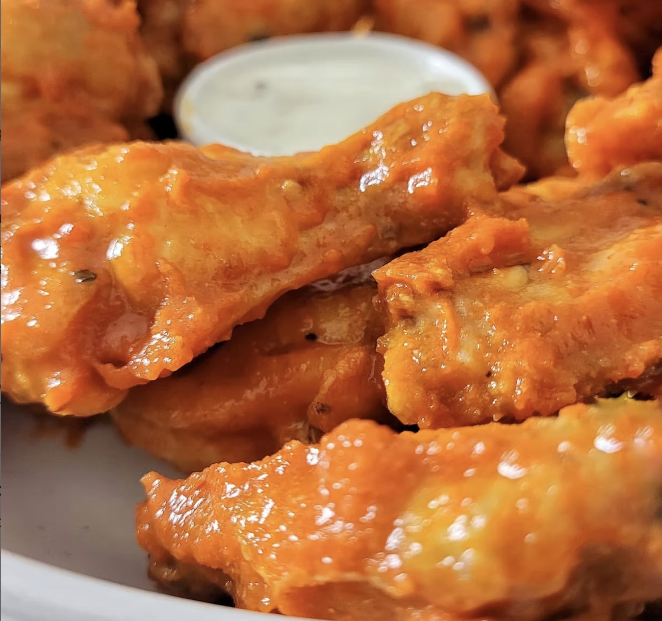 Ten jumbo fried chicken wings hand tossed in your choice of sauce (mild, medium, hot, Honey Garlic, Sweet Teriyaki, Mango Habanero, Hot Honey, Barbecue, Sweet Chili). Served with a side of Blue Cheese or Ranch.