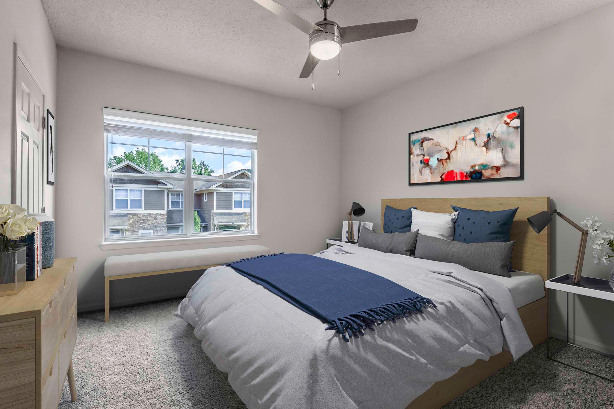 Townhome bedroom with ceiling fan and carpet flooring