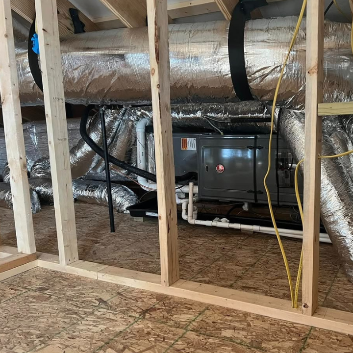 New Rheem gas furnace and Trion media air cleaner installed in a Southern Illinois basement.