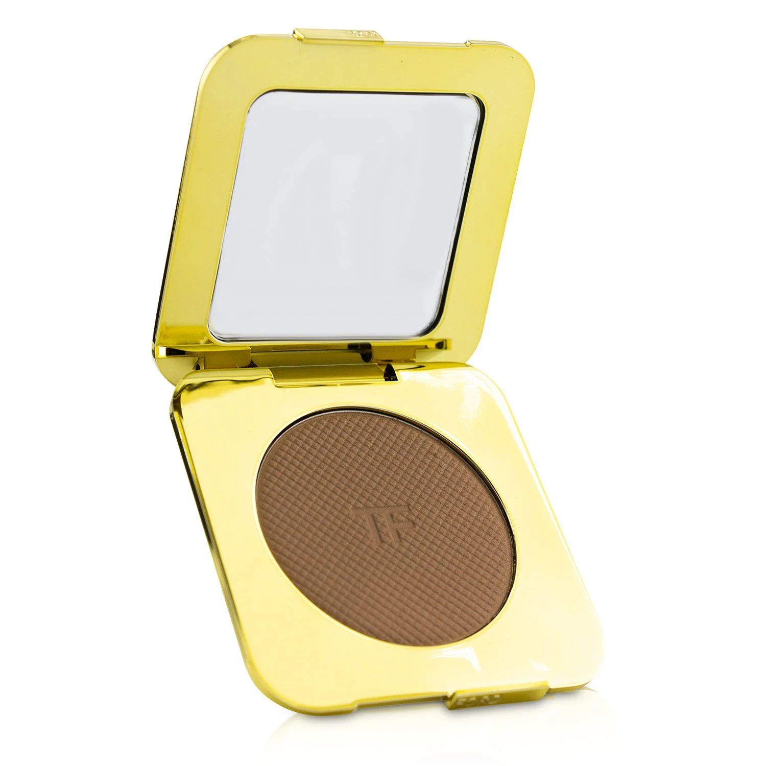 A golden compact makeup case is open, revealing a bronzer powder with a crosshatch pattern and embossed logo. A mirror is visible inside the lid.