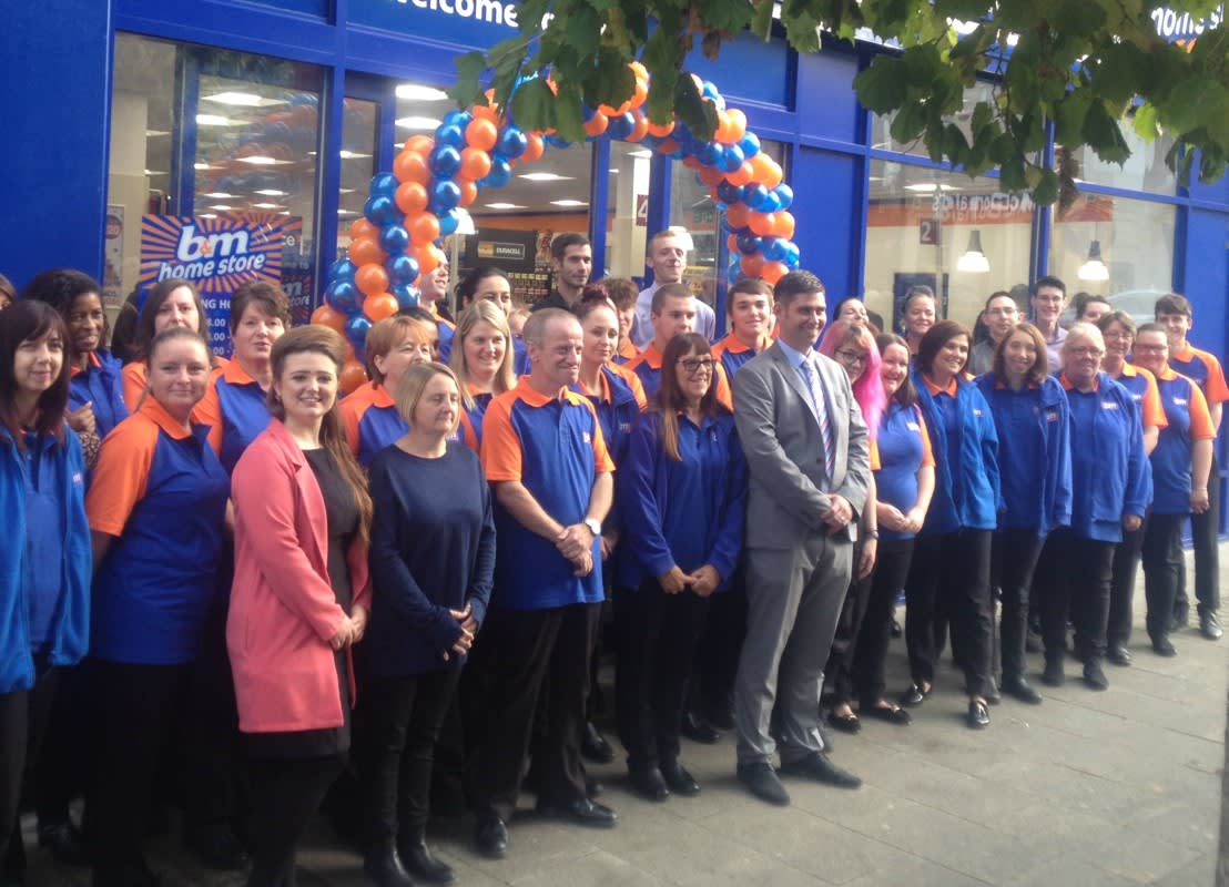 The B&M store team in Gravesend pose in front of their brand new Home Store on New Road.