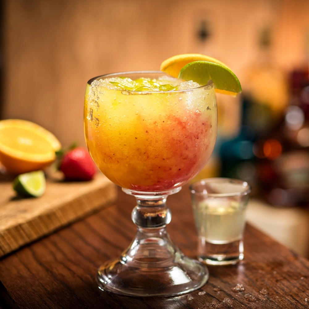 Maui Margarita: Half strawberry, half mango, accented with kiwi and a shot of DeKuyper Cactus Juice. Cheddar's Scratch Kitchen Lexington (859)272-0891