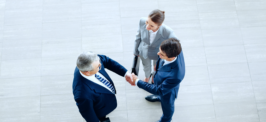 Private bankers shaking hands.