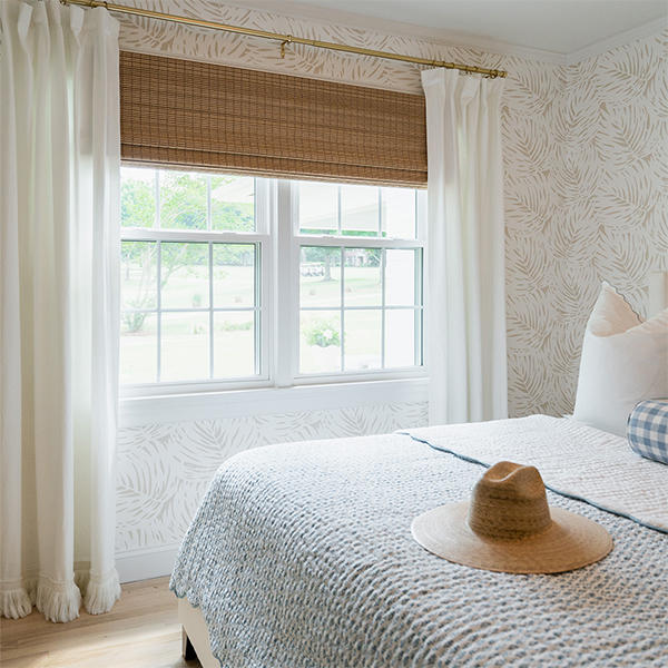 What a great way to add rustic charm to a bedroom. Woven wood shades come in a range of styles and all-natural materials like bamboo, jute and rattan reeds. Visit our website to see all of our shade options for your home.