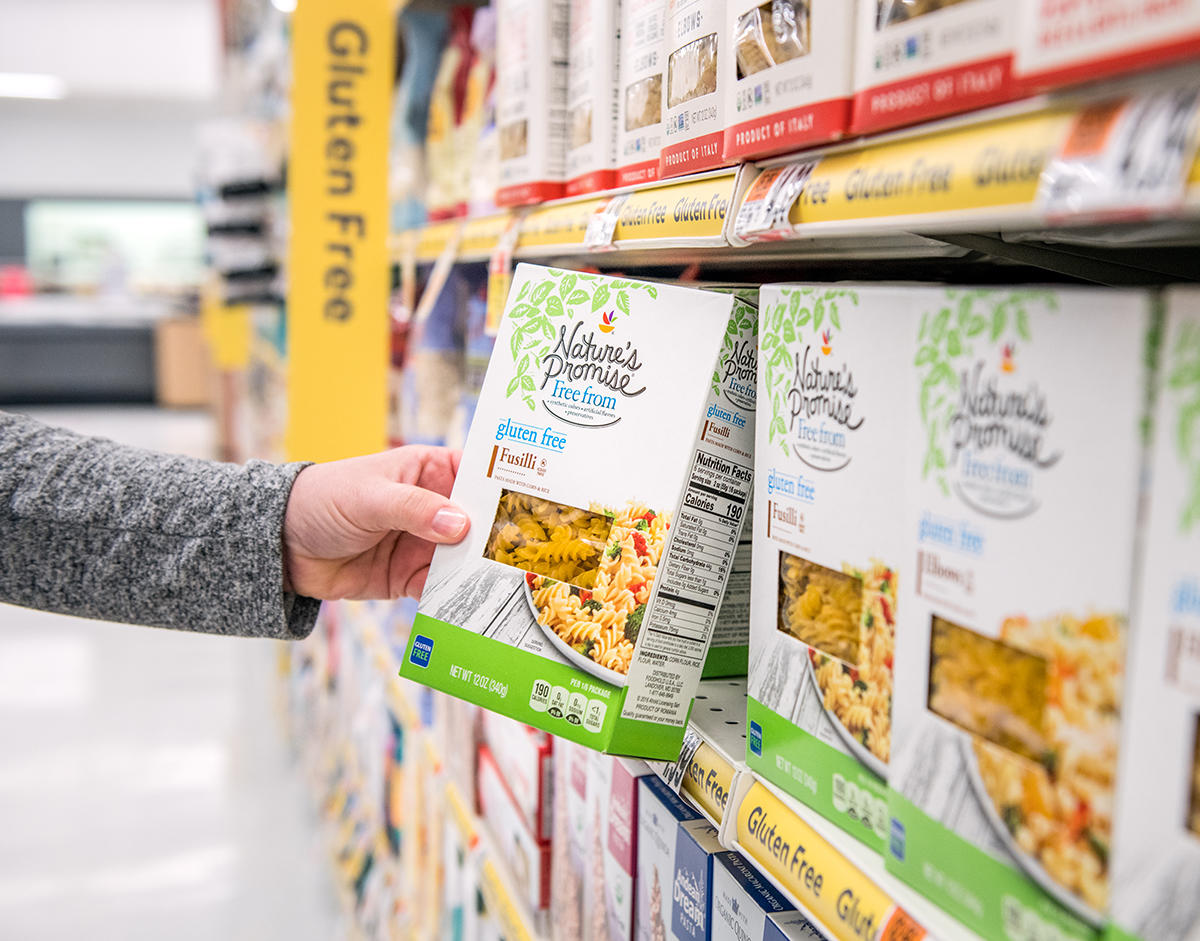 Tight shot of customer picking up a Nature's Promise item off the shelf. Stop & Shop-CLOSED Somerville (857)997-2292