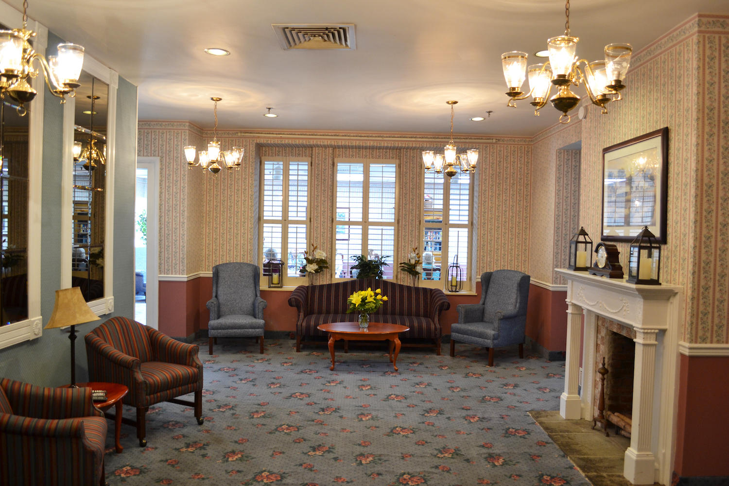 The Devon Senior Living seating area with fireplace