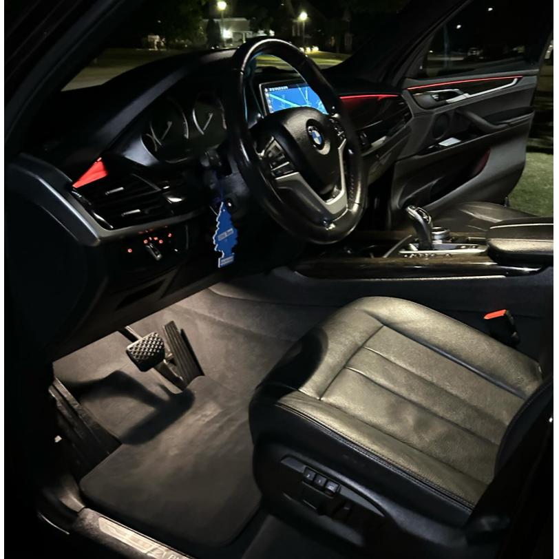 Clean BMW interior featuring detailed leather seats, carpets, dashboard, center console, and interio 