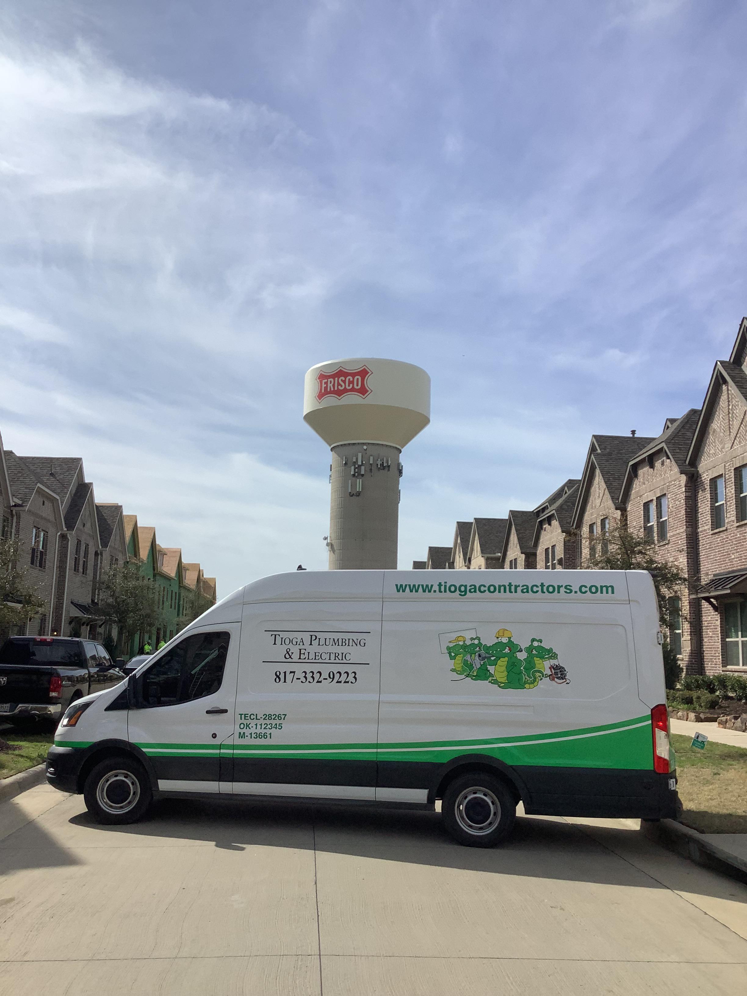 A Frisco Texas water tower with the Tioga service van.