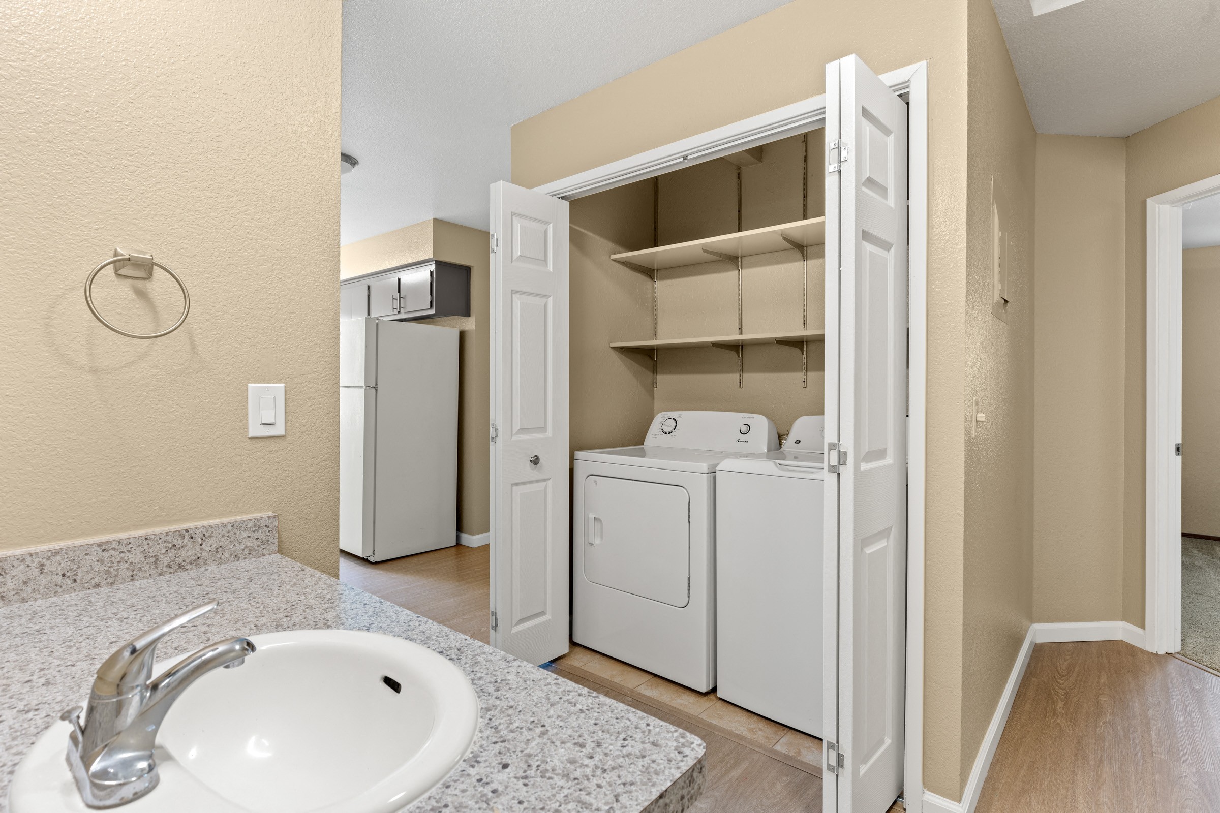 A white sink with a silver faucet in a bathroom.
