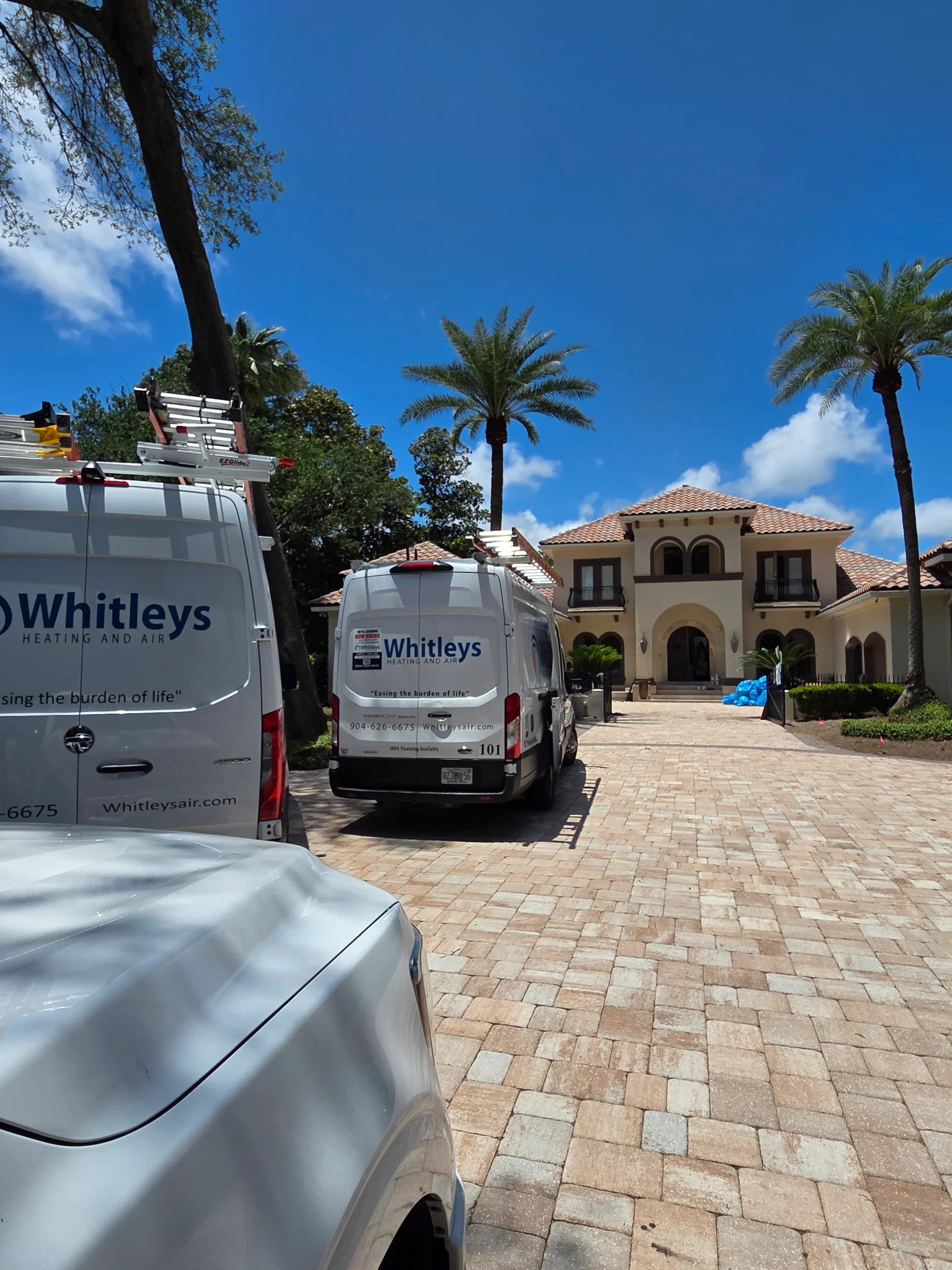Two white vans with 