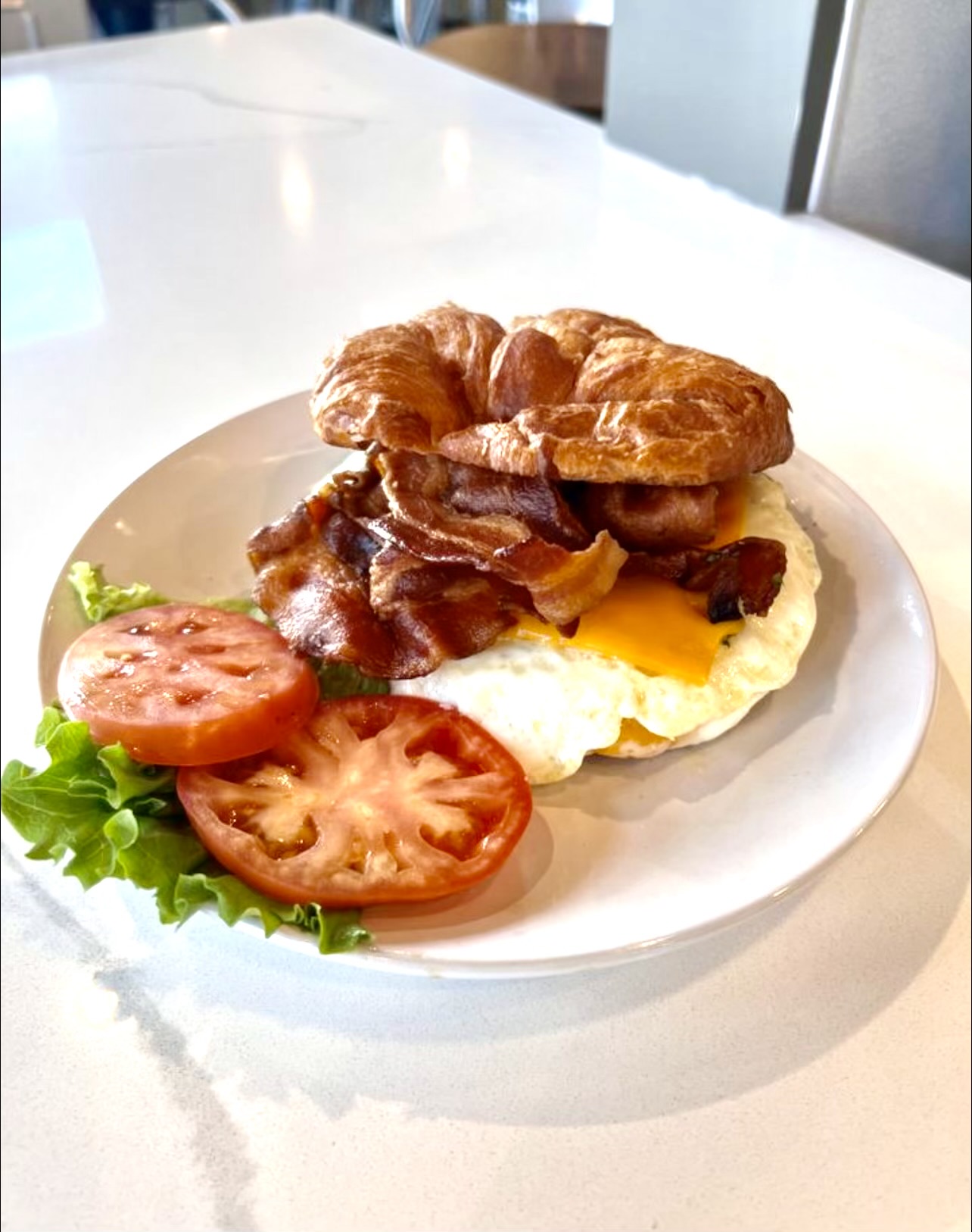 Flaky butter croissant layered with eggs, cheese, and your choice of protein for a rich, satisfying bite.
