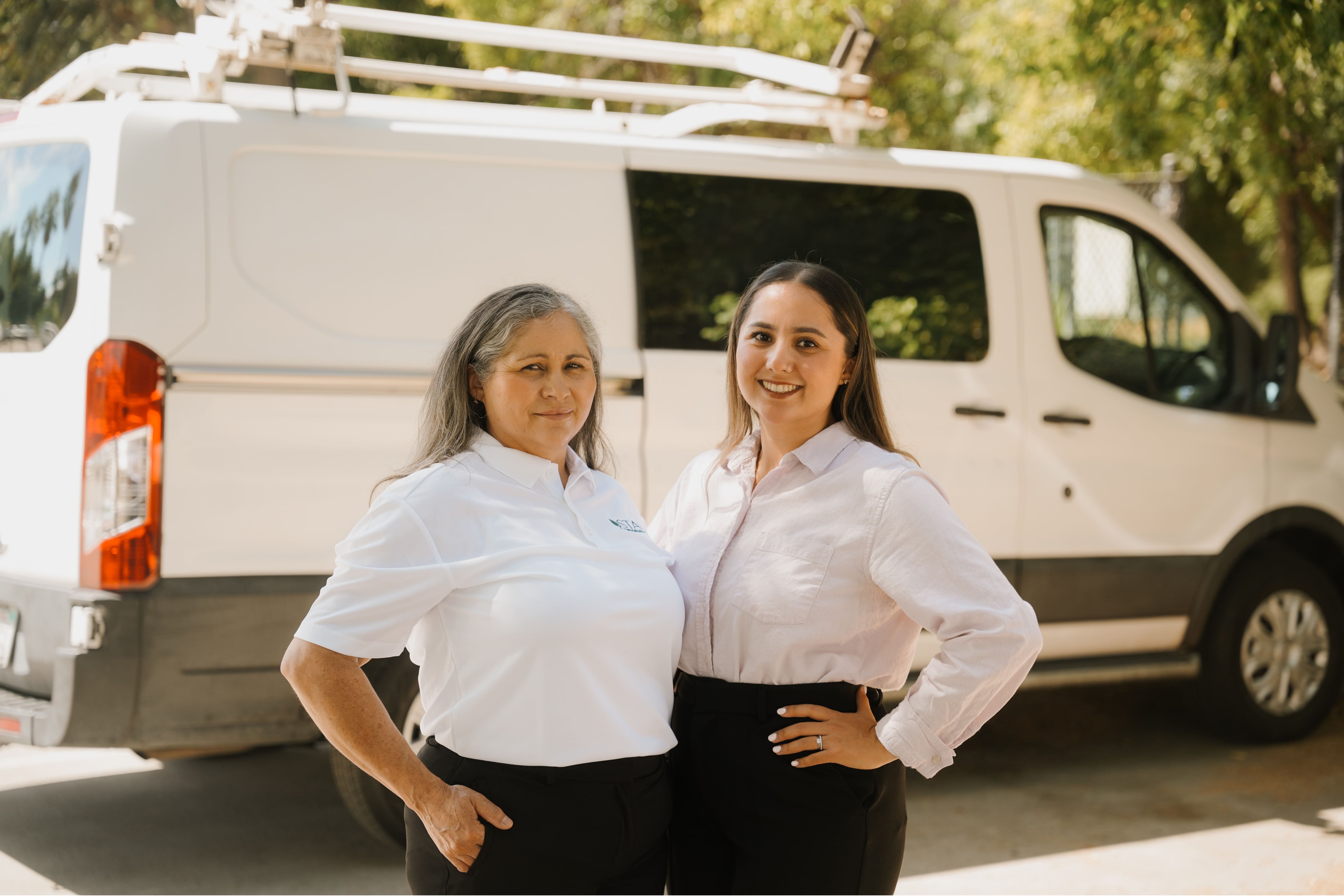 Two members of the Star's Janitorial Services team in front of a company service van, heading out to clean offices and commercial facilities in the Concord, CA area.