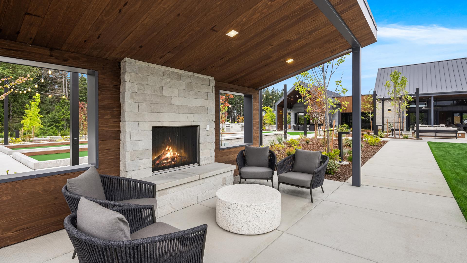 Patio with gas fireplace is a great spot to watch a pickleball match