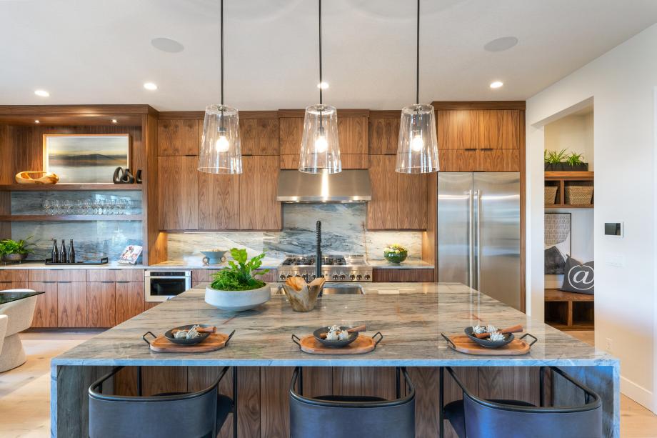 Gourmet kitchen with large center island and double-stacked cabinets
