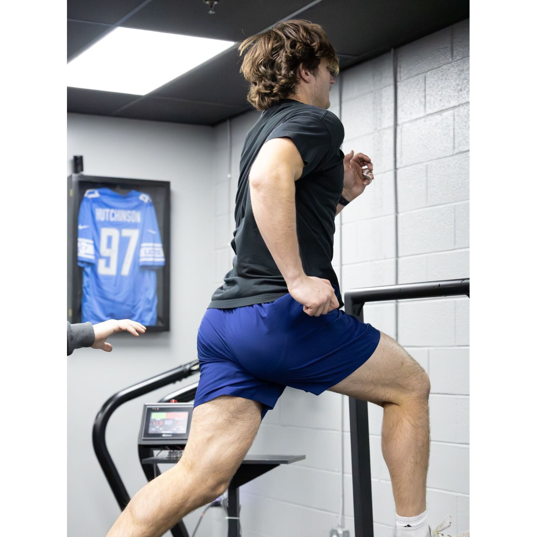 Male athlete performing treadmill sprint training at Impact Sports Performance